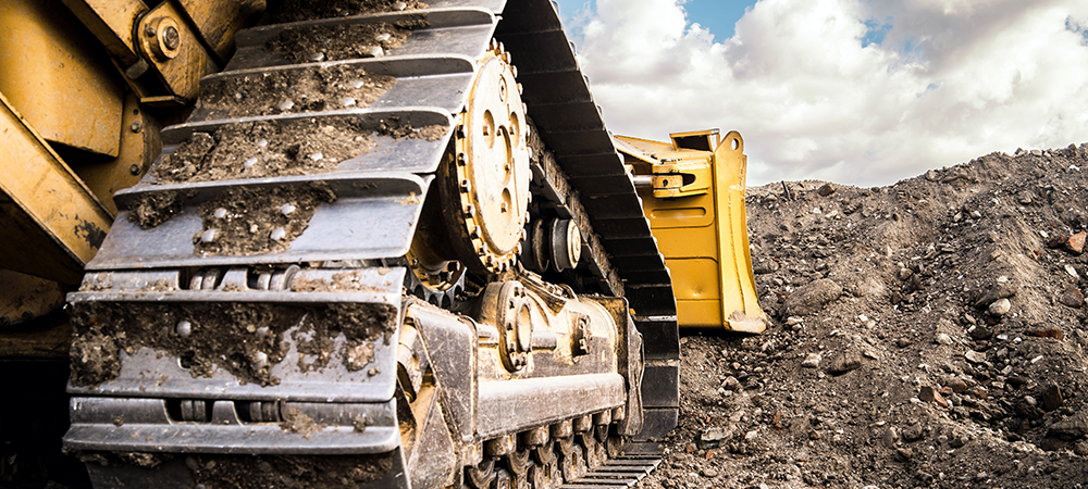 How has technology transformed the operations of industrial construction machines and other heavy equipment?